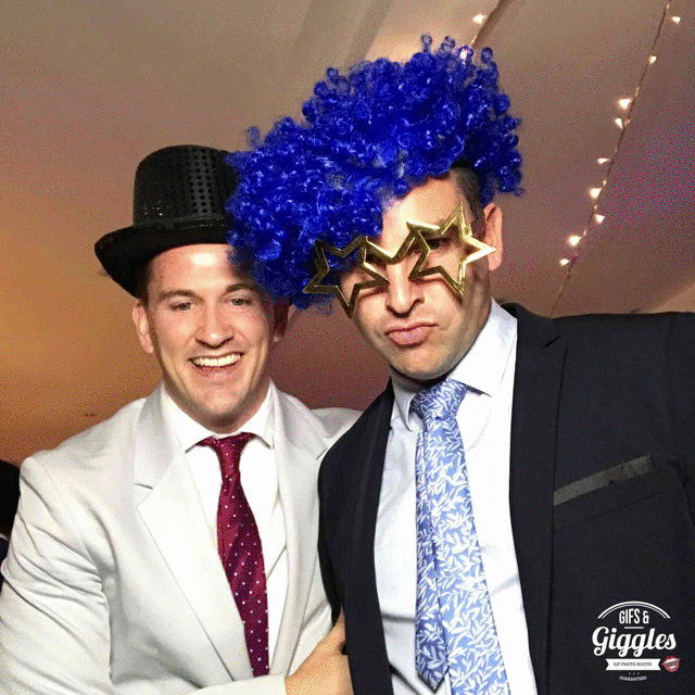 Two men posing for a FREE wedding gifbooth photo.