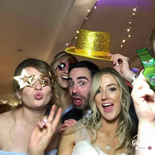 A wedding party capturing fun moments in a FREE gif booth.