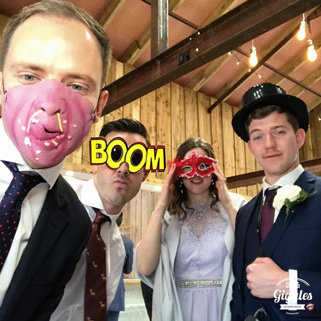 A FREE wedding GIF booth featuring a group of people posing with masks on their faces.