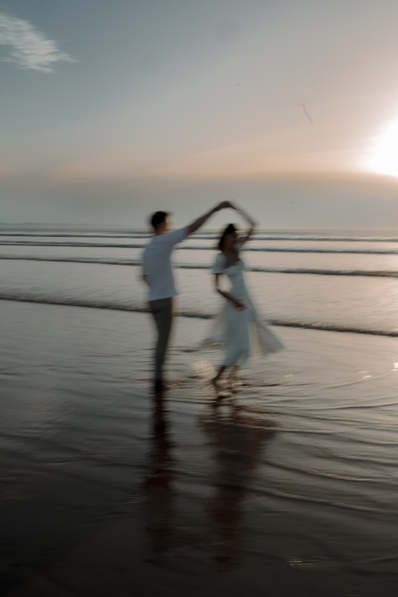 A FREE magic mirror transforms a newlywed couple's dance on the beach at sunset into an enchanting GIF booth experience.