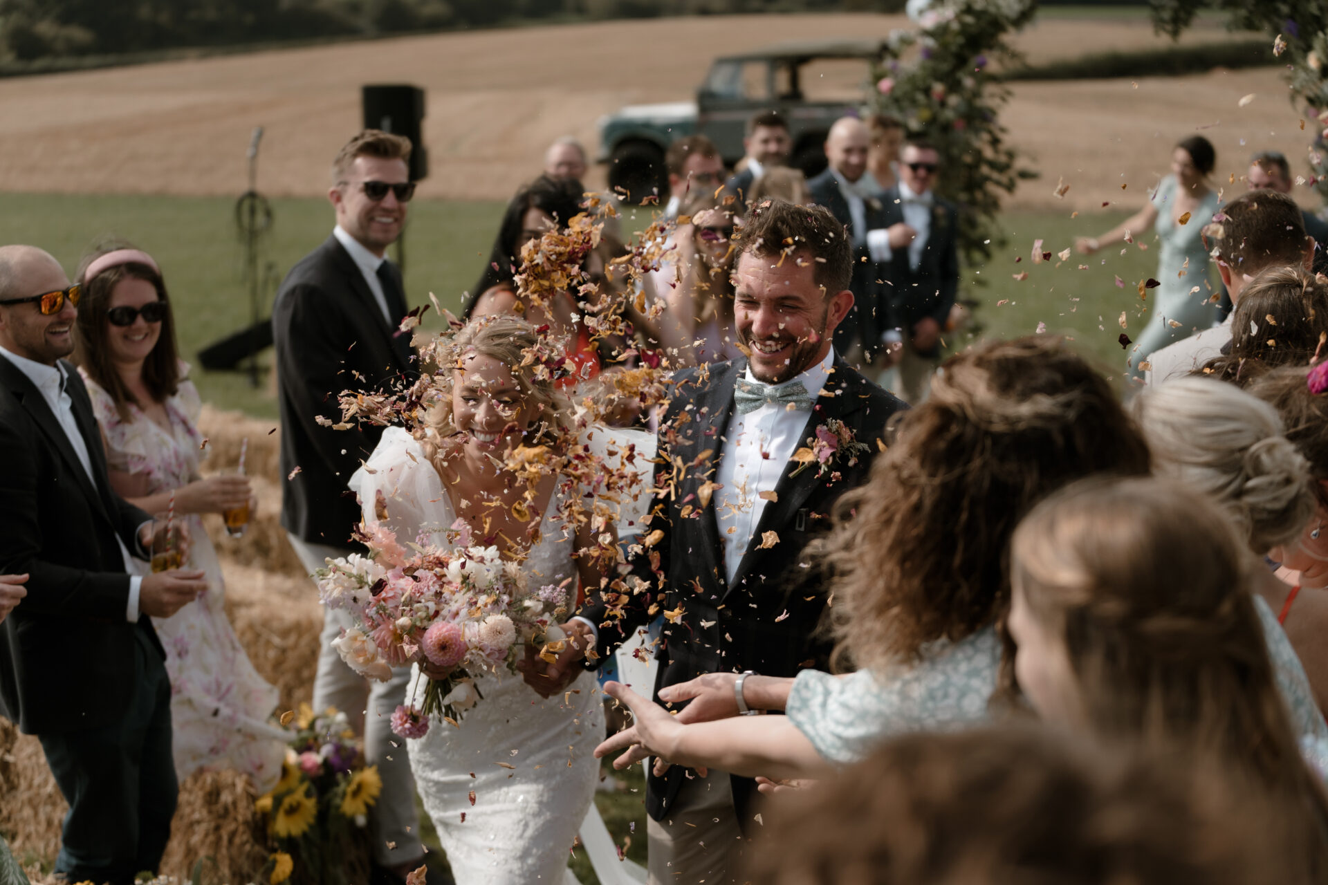 Recent wedding ceremony with confetti being thrown.
